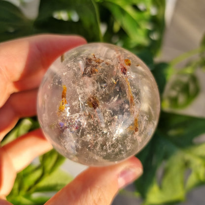 Clear Quartz sphere with Tourmaline inclusions