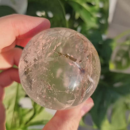 Clear Quartz sphere with Tourmaline inclusions